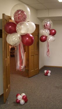 balloons and streamers in an office hallway for valentine's day party decorating