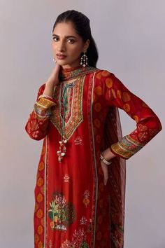 Red panelled kurta with printed scenic mughal motifs, embellished by beads and front tie. Comes with pant and dupatta. - Aza Fashions Red Silk Lawn Suit For Festive Occasions, Semi-stitched Silk Red Lawn Suit, Red Semi-stitched Silk Lawn Suit, Festive Red Silk Lawn Suit, Red Designer Lawn Suit With Traditional Drape, Red Lawn Suit With Dabka Work For Transitional Season, Red Silk Lawn Suit For Diwali, Red Silk Lawn Suit For Festivals, Red Lawn Suit With Dupatta For Transitional Season