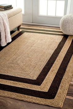 a large rug in the corner of a room