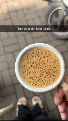 a person holding a cup of coffee in their hand with the caption tum se si din hota hai