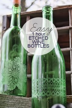 two green bottles sitting next to each other with the words easy 1 hour etched wine bottles