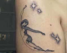 a woman's arm with a tattoo on it that has a girl holding a star