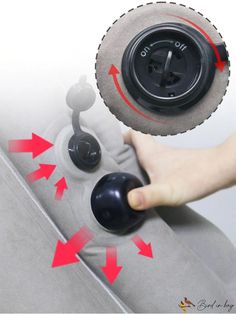 a person is pressing buttons on the back of a couch with an air vent cover