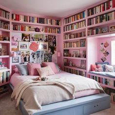 a bedroom with pink walls and lots of books on the shelves above the headboard