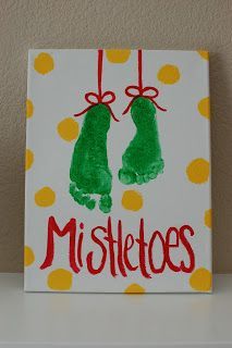 a handprinted sign with two green mittens hanging from it's sides