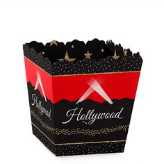 a black and red paper bag with gold stars on the bottom that says, hollywood