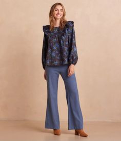 Discover the perfect blend of comfort and style with the Countryside Poplin Ruffle Blouse in Rustic Floral Midnight. This elegant blouse features a flattering ruffle detail and a rich floral print, making it a must-have for any wardrobe. Ideal for both casual and dressy occasions, its breathable poplin fabric ensures all-day comfort. Shop now for timeless style and effortless charm!