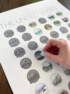 a person's hand is pointing at the united states sticker sheet