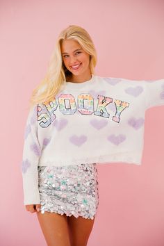 Get spooky and stylish with our SPOOKY HEART SWEATER! This cute and classic sweater features pastel purple hearts and colorful ghost lettering, perfect for adding a touch of Halloween to your wardrobe. Don't miss out on this must-have statement piece! All orders are currently shipping within 14 business days. To receive item quicker, expedited shipping is available at checkout. **ALL HALLOWEEN ORDERS MUST BE PLACED WITH EXPEDITED SHIPPING TO GUARANTEE DELIVERY BY OCT. 31 IF PLACED AFTER OCT. 15* Playful Letter Print Sweater For Fall, Purple Letter Print Sweater For Fall, Ghost Lettering, Colorful Ghost, Purple Hearts, Heart Sweater, Classic Sweater, Pastel Purple, Purple Heart