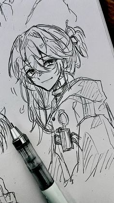 a pen is sitting on top of a paper with a drawing of an anime character