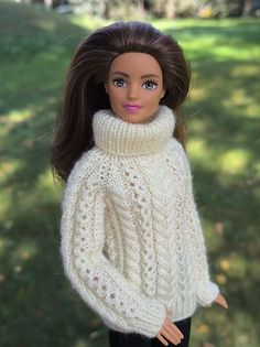 Elevate Barbie’s winter wardrobe with this Cozy Cream Knit Sweater. Designed for both standard and tall Barbie MTM dolls, it features a high neck and long sleeves. Easily dress your doll by sliding it over her head. Knitting Patterns For Barbie Clothes, Barbie Knitted Clothes Free Pattern, Barbie Knitted Jumper Pattern, Barbie Inspiration, Barbie Doll Sweater Knitting Pattern, Crochet Quilt Pattern, Cream Knit Sweater, Knitwear Collection, Crochet Barbie Clothes Free Ickythecat​​​​​​.com