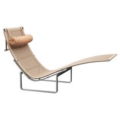 a chaise lounge chair with a wooden seat and back rest on a metal frame