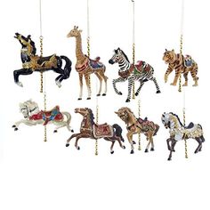 a group of toy horses hanging from strings