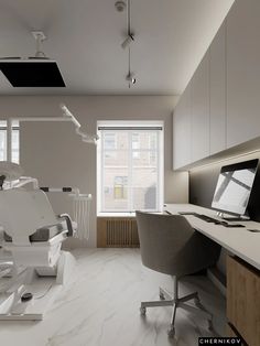 an office with desks, chairs and computers on the floor in front of large windows