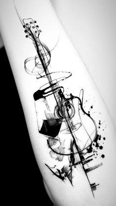 a black and white photo of an abstract tattoo design on the right arm, which has been drawn with ink