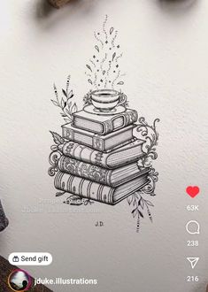 a stack of books sitting on top of a table next to a pen and ink