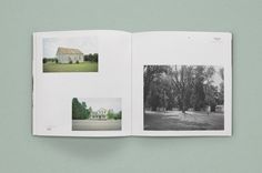 an open book with pictures of trees and houses on it's cover is shown in black and white