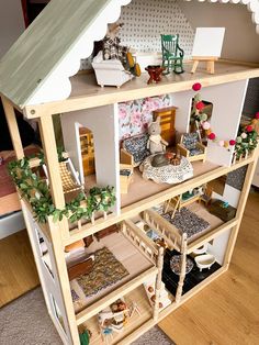 a doll house with lots of furniture and accessories