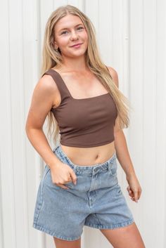 The perfect top to pair with any outfit- our new Move Along Crop Top! This new arrival can be worn all year round and styled in so many ways! Features a ribbed knit material, a square neckline, tank top straps, and a cropped length. Available in black, brown, and hunter green. polyester spandex turn inside out hand wash with cold water lay flat to dry low iron if needed Models are wearing a size small Spring Ribbed Crop Top With Square Neck, Trendy Ribbed Crop Top With Square Neck, Trendy Square Neck Tank Top For Spring, Trendy Seamless Square Neck Crop Top, Casual Ribbed Crop Top With Square Neck, Trendy Ribbed Square Neck Tank Top, Trendy Square Neck Crop Top For Spring, Ribbed Square Neck Trendy Tank Top, Tailgate Outfit