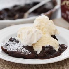 a white plate topped with chocolate cake and ice cream