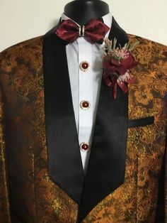 Our new brown & gold tuxedo will make a stunning addition to your formal wardrobe. This tuxedo is perfect for your next date night, wedding reception, anniversary, prom, or any special occasion.  This tuxedo also includes a bow tie of your choice, a boutonnière, and elegant button covers. Floral Tuxedo, Gold Tuxedo, Night Wedding Reception, Mens Wedding Suits, Brown Diamonds, Night Wedding, Brown Suits, Button Covers, Black Tuxedo