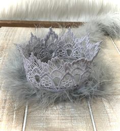 Thank you for supporting my small business! 💗  Follow me here and on Instagram.  What a great way to make a little one OR adult, feel like a princess or prince!! 👸🤴I have 6 lace crown styles.  Some are great for boys! Beautiful, hand made lace crowns.  Perfect for newborn photos, special occasions, birthdays and photo ops.  Add feathers, rhinestones, and/or a glitter birthday number! I make different crown designs and colors, giving you the option of simple to fancy. 💎  I also make 21-inch crowns for adults.  Check out my other listings in my Lace Crowns category! The venice lace is stiffened with a non-toxic fabric product. I DON'T  PAINT THE LACE. I secure a chenille stem around the crown base to help retain its shape. All crowns are 4 inches wide (12 inches diameter).  The lace size Crown Styles, Silver Crowns, 1st Birthday Crown, Newborn Crown, First Birthday Crown, Lace Crown, Feather Crown, Lace Crowns, Mini Crown