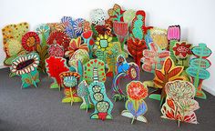 a group of colorfully painted wooden sculptures