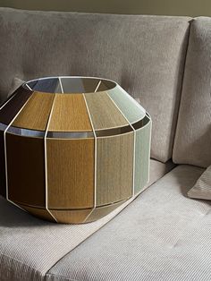 a table made out of different shades of wood on a couch in a living room