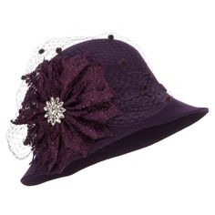 Flower Crystal Net Pom Wool ClocheMade of 100% wool.One size fits most women with an inner elastic adjustable tie, fitting up to 7 1/4.Fitted with an inner satin hatband.Adult/Woman.Crown measures 4 inches deep.Brim measures 3 - 3.5 inches long.Hand wash only.Imported. Fashionable wool felt cloche hat for ladies.Round and flexible crown.A big flower decoration with a small crystal flower inside is accented on one side.Decoration is detailed with a net and small poms.Slanted brim; side brim is sl Winter Vintage Brimmed Cloche Hat, Vintage Brimmed Cloche Hat, One Size Fits Most, Vintage Wool Cloche Hat With Flat Brim, Vintage Wool Cloche Hat With Curved Brim, Wool Vintage Brimmed Cloche Hat, Dressy Hats, Fall Outdoor, Cloche Hat, Crystal Flower