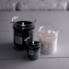 two candles sitting next to each other on a table