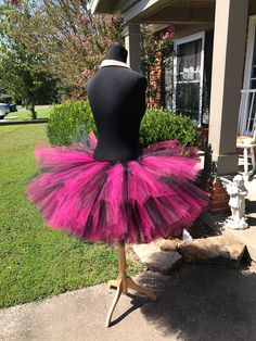 "This listing includes a Fuchsia and Black mixed tutu for waist sizes 35\" up to 45\" can be made larger if interested contact me for a special listing. Other colors also available. Tutu pictured is a 15\"tutu with a top layer that is 12\". Tutu can be all one length or the dual lengths. **please just note the length you would like or lengths you would like upon checkout** Thank you for shopping with Princess Tutus Boutique. If you have any questions please feel free to convo us at anytime and w Pink Fitted Halloween Skirt, Fitted Pink Skirt For Costume Party, Fitted Skirt For Halloween Dance, Pink Fitted Skirt For Costume Party, Fitted Tiered Skirt Petticoat For Costume, Pink Tulle Petticoat For Costume Party, Pink Tulle Skirt For Costume Party, Fitted Pink Petticoat For Dance, Pink Fitted Petticoat For Dance