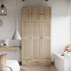 a living room with a white couch and wooden cabinet next to a window on the wall