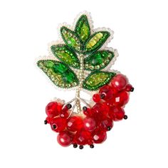 beaded brooch with red berries and green leaves