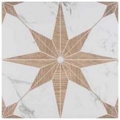 a white and brown tile with a star design on it