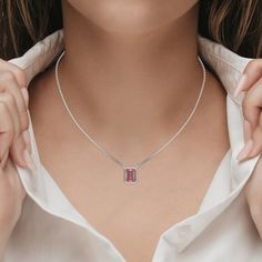 Fancy Pink Emerald Solitaire Diamond Necklace made with an fancy Pink emerald cut diamond in bezel setting with adjustable chain. ✦ 𝐒𝐭𝐨𝐧𝐞 𝐃𝐞𝐭𝐚𝐢𝐥𝐬✧ Shape: Emerald✧ Focal Stone Size: 1.00 CT, 1.50 CT, 2.00 CT, 2.50 CT, 3.00 CT✧ No of Diamonds: 1✧ Stone Type: Lab Grown Diamond ✧ Diamond Clarity: VS1+✧ Diamond Color: Fancy Pink ★ 𝐍𝐞𝐜𝐤𝐥𝐚𝐜𝐞 𝐃𝐞𝐭𝐚𝐢𝐥𝐬: ✧ Metal Type: Solid Gold ✧ Metal Purity: 14K Solid Gold, 18K Solid Gold ✧ Metal Tone: Yellow Gold, White Gold, Rose Gold✧ Setti Pink Emerald, Diamond Solitaire Necklace, Halo Earrings Studs, Halo Earrings, Vs Diamond, Solitaire Necklaces, Diamond Charm, Fancy Color Diamonds, Emerald Cut Diamonds