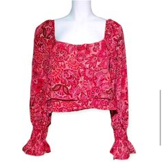 Elevate Your Wardrobe With This Stunning Red Paisley Floral Crop Ruffle Blouse. Featuring A Trendy Square Neckline And Long Sleeves, This Blouse Is Perfect For Any Occasion. The Paisley Pattern And Ruffle Accents Add A Touch Of Femininity To This Versatile Top. Pair It With Jeans For A Casual Look Or Dress It Up With A Skirt For A Night Out. The Blouse Is Brand New With Tags And Comes In A Variety Of Sizes To Fit Any Woman's Style. Add This Beautiful And Unique Blouse To Your Collection Today. Red Square Neck Top For Spring, Spring Red Blouse With Blouson Sleeves, Red Paisley Print Summer Top, Summer Red Blouse With Paisley Print, Red Long Sleeve Blouse With Blouson Sleeves, Bohemian Fitted Blouse With Square Neck, Red Blouse With Blouson Long Sleeves, Bohemian Square Neck Fitted Blouse, Fitted Bohemian Blouse With Square Neck