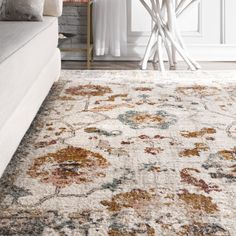 a large white rug with colorful flowers on it