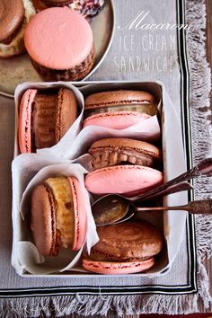 a box filled with lots of different types of macaroons