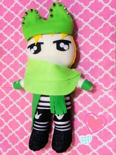 a stuffed animal with a green crown on top of it's head and legs