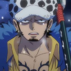 an anime character holding a large stick in his right hand and looking at the camera