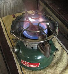 a green stove top sitting on top of a rug