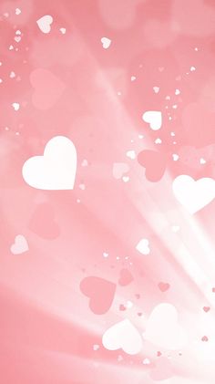 hearts are flying in the air on a pink and white background with sunbeams