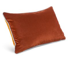 a brown pillow with an orange stripe on it and a white border around the edges