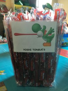 there is a bag of yoshi tongue candy on the table