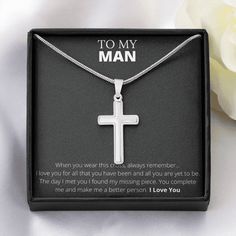 a necklace with the words to my man on it in a box next to a white rose