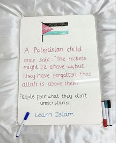 a piece of paper with a poem written on it and crayons next to it