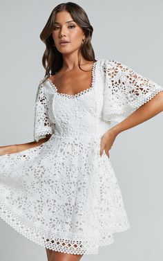 Get ready to turn heads in the Marisole Mini Dress! This stunning A-line flutter sleeve lace dress in white is perfect for any party day or night. The sweetheart neckline and mini length add a flirty touch, while the short sleeves provide just the right amount of coverage. Made from high-quality polyester, this dress is both comfortable and stylish. Whether you're attending a special occasion or simply want to feel fabulous, the Marisole Mini Dress is the perfect choice. Don't wait - make a stat Sleeve Lace Dress, Lace Dress With Sleeves, White Dress Party, Going Out Dresses, Lace Fabric, Party Dresses, Flutter Sleeve, Sweetheart Neckline, Sheath Dress