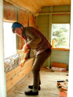 a man standing on top of a wooden floor