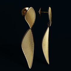 Elevate your elegance with these exquisite Italian-made dangle drop earrings by Oltremare Gioielli. Handcrafted with precision and artistry, these earrings are a true celebration of fine craftsmanship and luxurious materials.Made from your choice of 14k or 18k gold, these earrings feature:A ribbed textured surface that adds depth and sophisticationPolished edges for a sleek, refined finishA stunning length of 50 mm (2 inches) and width of 12 mm (0.47 inches), making them a statement piece withou Modern Earrings With Elegant Design For Gift, Modern Elegant Earrings For Gift, Elegant Drop Linear Earrings As Gift, Classic Yellow Gold Drop Chandelier Earrings, Elegant Linear Drop Earrings For Gift, Luxury White Gold Long Drop Earrings, Luxury Single Linear Earring For Anniversary, Gold-plated Yellow Gold Earrings, Polished Finish Drop Earrings For Wedding