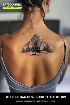 the back of a woman's neck with a tattoo on it that has trees and mountains